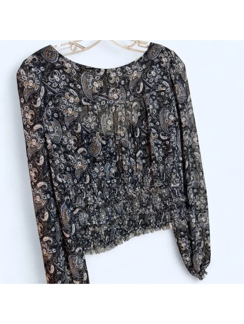Black and grey paisley print blouse with long sleeves and ruffled hem